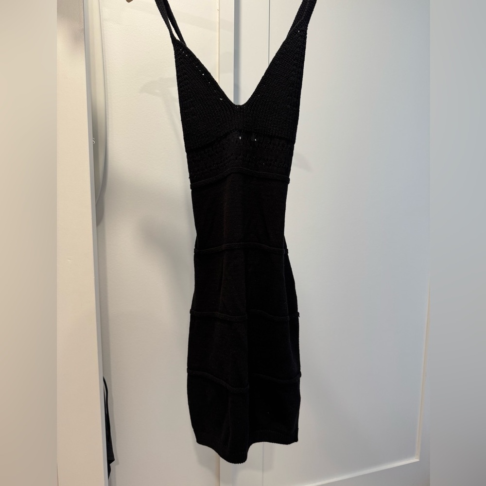 Chunky knit black dress with back straps and pattern in stomach!